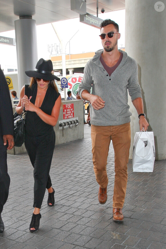 Lea Michele à l'aéroport de Los Angeles avec son nouveau petit ami Matthew Paetz, le 15 juillet 2014.