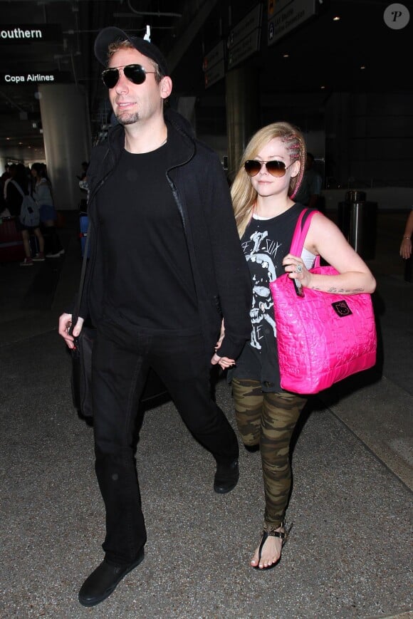 Avril Lavigne et Chad Kroeger à l'aéroport de Los Angeles, le 7 octobre 2013.