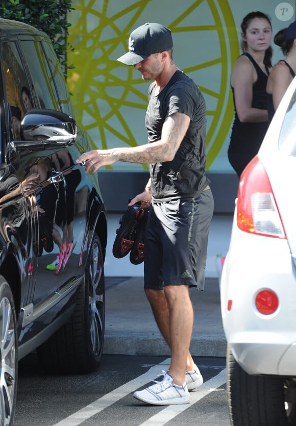David Beckham à la sortie du SoulCycle avec sa femme Victoria à Brentwood, le 21 août 2014.