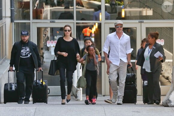 Brad Pitt and Angelina Jolie avec leurs enfants Maddox et Zahara à Los Angeles, le 14 jun 2014.