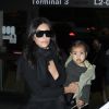 Kim Kardashian et sa fille de 13 mois North à l'aéroport Lax de Los Angeles, le samedi 30 août 2014.
