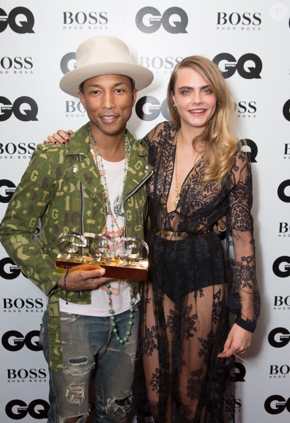 Cara Delevingne et Pharrell Williams lors de la soirée "GQ Men of the Year Awards 2014" à Londres, le 2 septembre 2014.