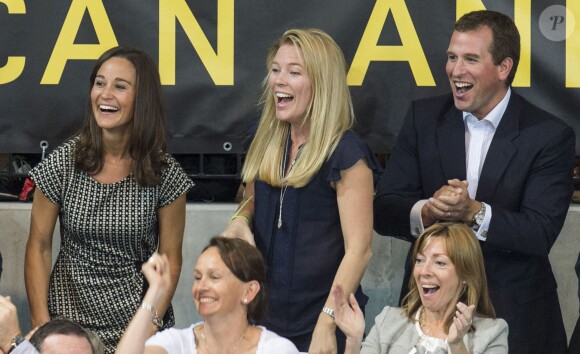 Au côté de sa femme Autumn, Peter Phillips n'était pas le dernier à vibrer devant le prince Harry, Zara Phillips et Mike Tindall lors de leur match exhibition de rugby en fauteuil roulant lors des Invictus Games, le 12 septembre 2014 à la Copperbox Arena, à Londres.