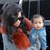 Kim Kardashian et sa fille North West arrivent à l'aéroport LAX. Los Angeles, le 22 septembre 2014.