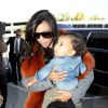 Kim Kardashian et sa fille North West arrivent à l'aéroport LAX. Los Angeles, le 22 septembre 2014.