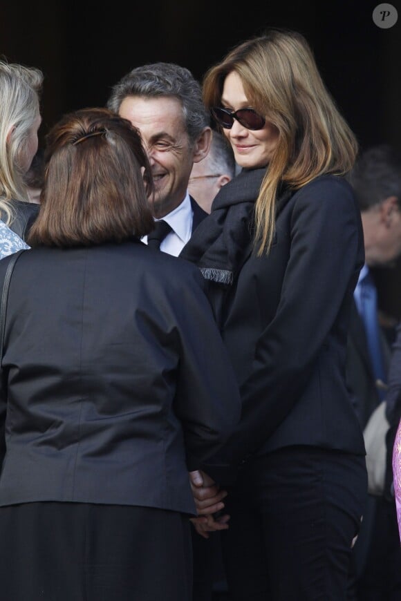 Nicolas Sarkozy et sa femme Carla Bruni Sarkozy - Cérémonie en l'honneur de l'ancien préfet Christian Frémont, qui fut le directeur de cabinet de Nicolas Sarkozy à l'Elysée, en l'église Saint-François-Xavier à Paris, le 24 septembre 2014.