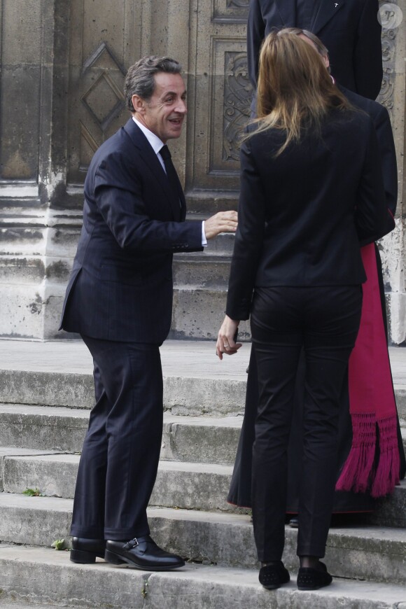 Nicolas Sarkozy et son épouse - Cérémonie en l'honneur de l'ancien préfet Christian Frémont, qui fut le directeur de cabinet de Nicolas Sarkozy à l'Elysée, en l'église Saint-François-Xavier à Paris, le 24 septembre 2014.