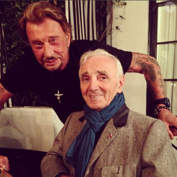 Johnny Hallyday et Charles Aznavour à Los Angeles, le 13 septembre 2014.