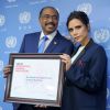 Victoria Beckham intronisée ambassadrice de bonne volonté de l'UNAIDS lors d'une conférence de presse, au côté du directeur général du programme, Michel Sidibé. New York, le 25 septembre 2014.
