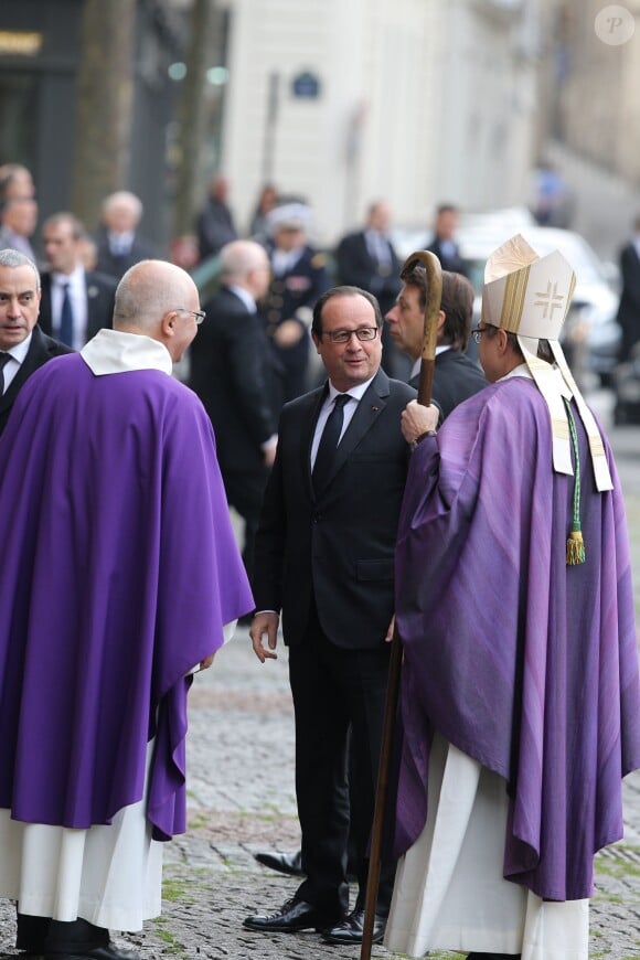 François Hollande lors des obsèques de Christophe de Margerie, président de Total décédé dans un accident d'avion, en l'église Saint-Sulpice à Paris, le 27 octobre 2014