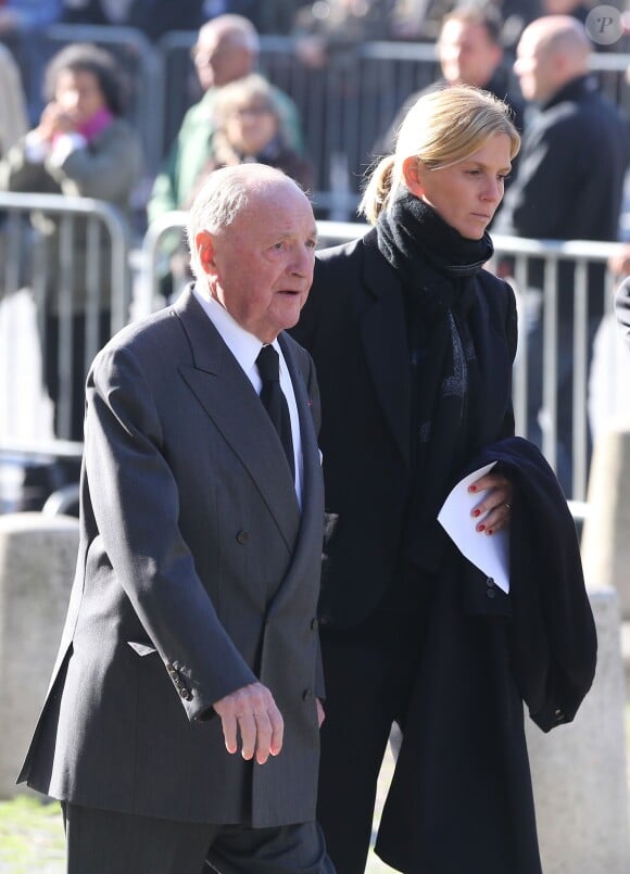Le baron Albert Frère et sa fille Ségolène Gallienne lors des obsèques de Christophe de Margerie, président de Total décédé dans un accident d'avion, en l'église Saint-Sulpice à Paris, le 27 octobre 2014