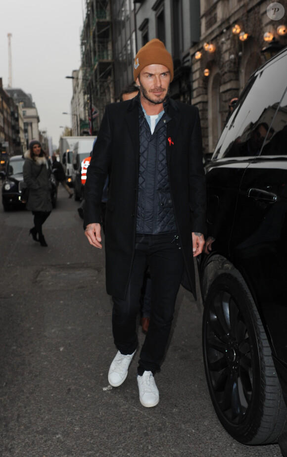 David Beckham a accompagné son épouse Victoria dans son magasin situé à Dover Street. Londres, 1er décembre 2014.
