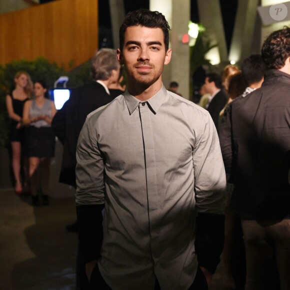 Joe Jonas assiste à la soirée Break the Internet organisée par le magazine Paper Magazine, Sprout By HP et DKNY à Miami. Le 4 décembre 2014.