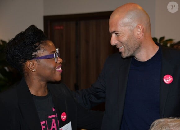 Zinédine Zidane et Claudia Tagbo lors du "Bilan & Perspectives" du "Club des entreprises qui marchent pour ELA" au siège de Boston Consulting Group (BCG) à Paris le 1er décembre 2014