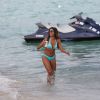 L'actrice et star de télé-réalité Claudia Jordan et des amies profitent d'un après-midi ensoleillé sur une plage de Miami. Le 1er janvier 2015.
