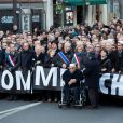 Les dirigeants politiques mondiaux, les membres de l'équipe de Charlie Hebdo et les familles des victimes défilent à la marche républicaine pour Charlie Hebdo à Paris le 11 janvier 2015