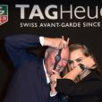 Cara Delevingne et Jean-Claude Biver (PDG de TAG Heuer) - Cara Delevingne nouvelle ambassadrice de la marque Tag Heuer avec un lionceau dans les bras le 23 janvier 2015 à Paris au Palais des Beaux-Arts.