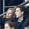 Claire Chazal complice avec son fils François Poivre d'Arvor lors du match de Ligue des Champions le Paris Saint-Germain et Chelsea au Parc des Princes, à Paris le 17 février 2015