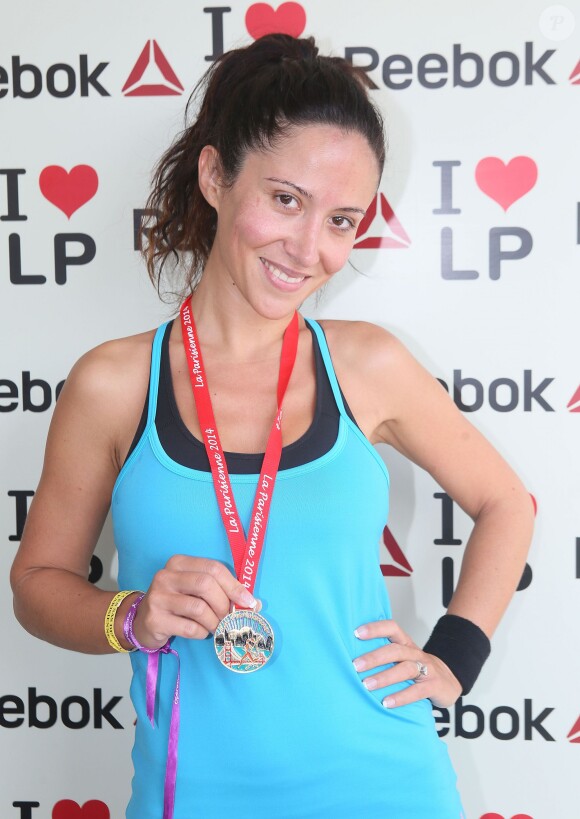 Fabienne Carat lors de la course "La Parisienne 2014" pour la lutte contre le cancer, au Champs de Mars à Paris, le 14 septembre 2014