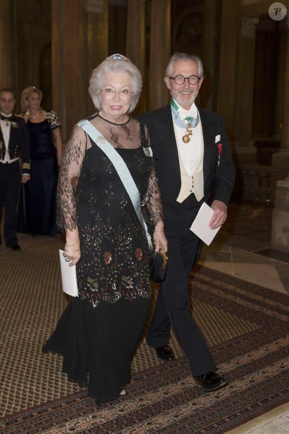 La princesse Christina de Suède et son mari Tord Magnuson le 11 février 2015 au palais royal à Stockholm, pour le premier dîner officiel de l'année.