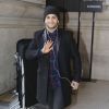 Malik Bentalha arrive au Grand Palais pour assister au défilé Guy Laroche automne-hiver 2015-2016. Paris, le 4 mars 2015.