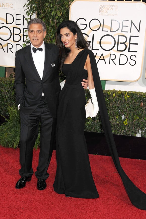 George Clooney et sa femme Amal Alamuddin (robe Dior Haute Couture) - 72e cérémonie des Golden Globe Awards à Beverly Hills, le 11 janvier 2015.