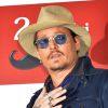 Johnny Depp pose lors du photocall du film "Charlie Mortdecai" à Tokyo, le 28 janvier 2015.