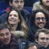 Thomas Hollande et une amie assistent au match de football France - Bresil au Stade de France à Saint-Denis le 26 mars 2015