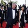 Patrick Poivre d'Arvor et une amie - Montée des marches du film "Mia Madre" lors du 68e Festival International du Film de Cannes, le 16 mai 2015.