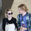 Emma Roberts et son fiancé Evan Peters arrivent à l'aéroport de Roissy-Charles-de-Gaulle le 26 février 2014