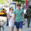 Emma Roberts, tres joyeuse, et son petit ami Evan Peters se promenent a New York, le 21 mai 2013.  