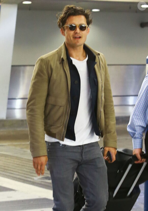 Orlando Bloom arrive à l'aéroport de Miami, le 16 avril 2015.