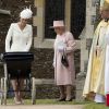Catherine, duchesse de Cambridge et sa fille la princesse Charlotte de Cambridge, la reine Elisabeth II lors du baptême de la princesse Charlotte en l'église Saint Mary Magdalene de Sandringham, le 5 juillet 2015