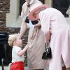 La reine Elisabeth II, le prince George de Cambridge et le prince William lors du baptême de la princesse Charlotte en l'église Saint Mary Magdalene de Sandringham, le 5 juillet 2015