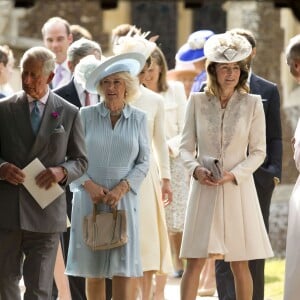 Le prince Charles, Camilla Parker Bowles, la duchesse de Cornouailles, Carole Middleton lors du baptême de la princesse Charlotte en l'église Saint Mary Magdalene de Sandringham, le 5 juillet 2015