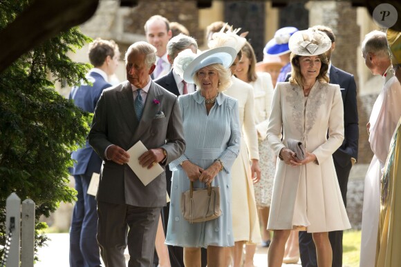 Le prince Charles, Camilla Parker Bowles, la duchesse de Cornouailles, Carole Middleton lors du baptême de la princesse Charlotte en l'église Saint Mary Magdalene de Sandringham, le 5 juillet 2015