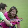Andy Murray et Amélie Mauresmo, enceinte, lors d'un entraînement au All England Lawn Tennis and Croquet Club de Wimbledon, à Londres le 7 juillet 2015