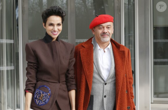 Farida Khelfa et Christian Louboutin au défilé de mode "Louis Vuitton", collection prêt-à-porter automne-hiver 2015/2016, à Paris le 11 mars 2015