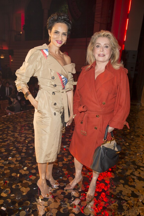 Farida Khelfa et Catherine Deneuve au dernier défilé de mode "Jean Paul Gaultier", collection prêt-à-porter printemps-été 2015, au Grand Rex à Paris le 27 septembre 2014