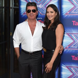 Simon Cowell et sa compagne Lauren Silverman lors du lancement de l'émission "The X Factor" au Ham Yard Hotel à Londres, le 27 août 2014.