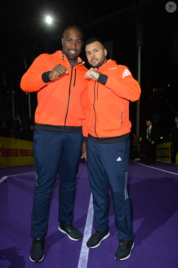 Teddy Riner avec Jo-Wilfried Tsonga lors de la finale de l'Adidas Boost Battle Run à la Grande Halle de la Villette à Paris le 21 février 2015