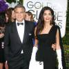 George Clooney et sa femme Amal Alamuddin Clooney (robe Dior Haute Couture) - "Je suis Charlie" à la 72ème cérémonie annuelle des Golden Globe Awards à Beverly Hills, le 11 janvier 2015.