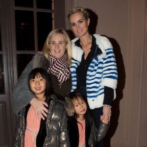 Exclusif - Laeticia Hallyday, ses filles Jade et Joy, et Hélène Darroze, la marraine de Joy, qui est co-présidente de l'association "La Bonne Etoile". À Paris, le 15 décembre 2013.