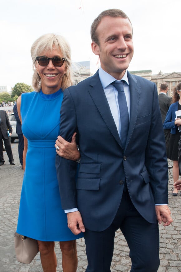 French Minister of the Economy, Industry and the Digital Sector Emmanuel Macron and his wife Brigitte Trogneux during the 2015 annual Bastille Day military parade on Place de la Concorde square in Paris, France on July 13, 2015. President Pena Nieto is on a three-day state visit to France. Photo by Thierry Orban/ABACAPRESS.COM14/07/2015 - Paris