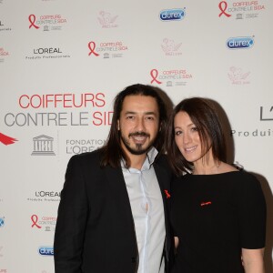 Archives - Moundir et sa femme Inès lors de l'opération " Coiffeurs Contre le Sida " édition 2014 à l'Académie L'Oréal Produits Professionnels à Paris, le 1er décembre 2014.