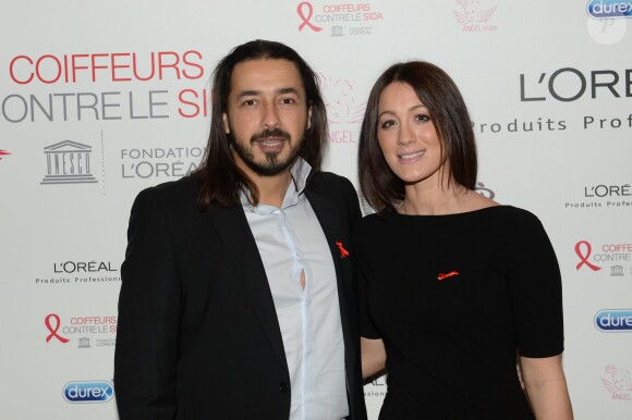 Archives - Moundir et sa femme Inès lors de l'opération " Coiffeurs Contre le Sida " édition 2014 à l'Académie L'Oréal Produits Professionnels à Paris, le 1er décembre 2014.