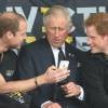 Le prince Charles et ses fils les princes Harry et William assistent aux Invictus Games 2014 à Londres, le 11 septembre 2014.