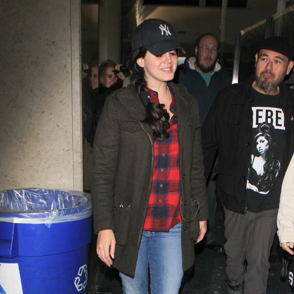 Lana Del Rey arrives in Los Angeles wearing plaid with denim and boots, Los Angeles, CA, USA on December 13, 2015. The singer makes the lumberjack garb look cute as she pairs it with a NY cap. Photo by GSI/ABACAPRESS.COM14/12/2015 - Los Angeles