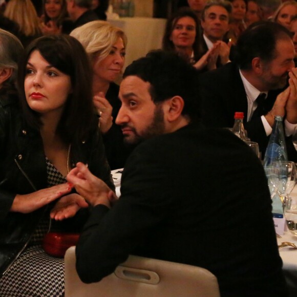 Exclusif - L'animateur Cyril Hanouna et sa compagne Emilie à l'Hôtel de Ville de Paris le 10 décembre 2013. 