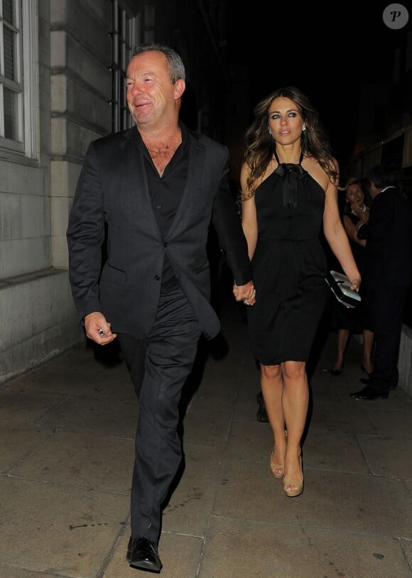 Elizabeth Hurley et son petit ami David Yarrow de sortie à Londres, le 30 avril 2014.